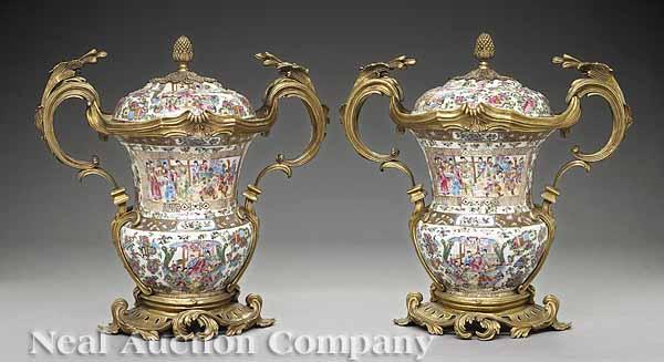 Appraisal: A Pair of Chinese Gilt-Bronze-Mounted Famille Rose Porcelain Covered Urns