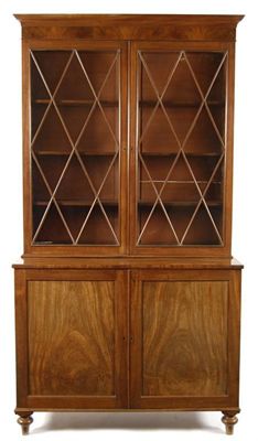 Appraisal: An early th century mahogany bookcase cabinet the detachable cornice