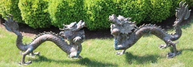 Appraisal: TWO SIMILAR BRONZE CHINESE DRAGONS TH CENTURY OLD GREEN FINISH