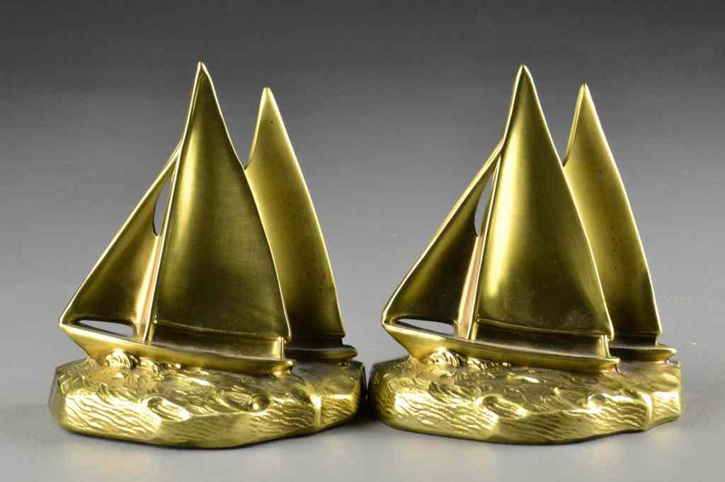 Appraisal: Pair of Bronze Sailboat BookendsEach bookend depicting two sailboats racing