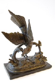 Appraisal: CAST BRONZE PATINATED FIGURE OF A BIRD ON A BRANCH