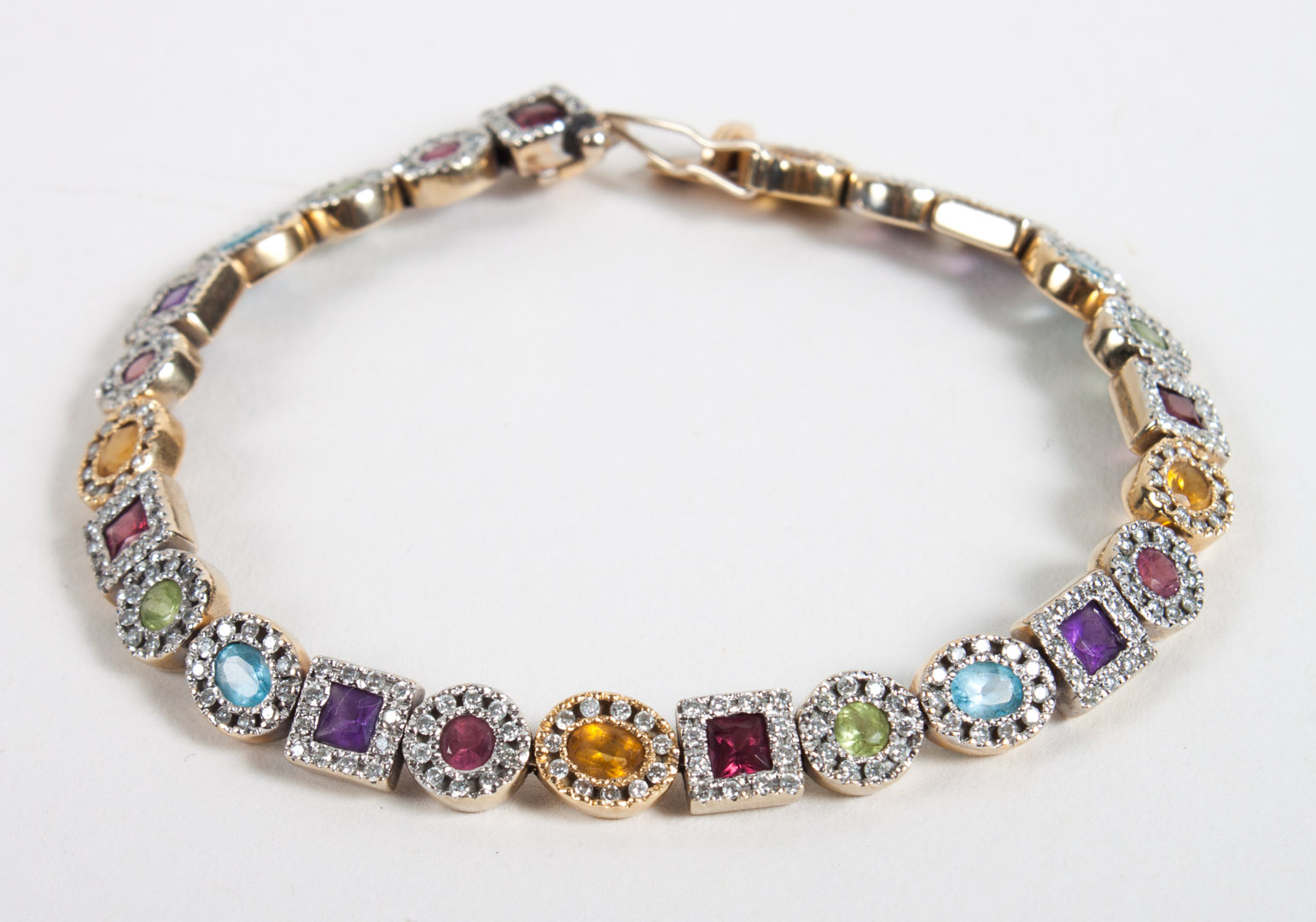 Appraisal: K gold multi-stone tennis bracelet various colored stones with diamond