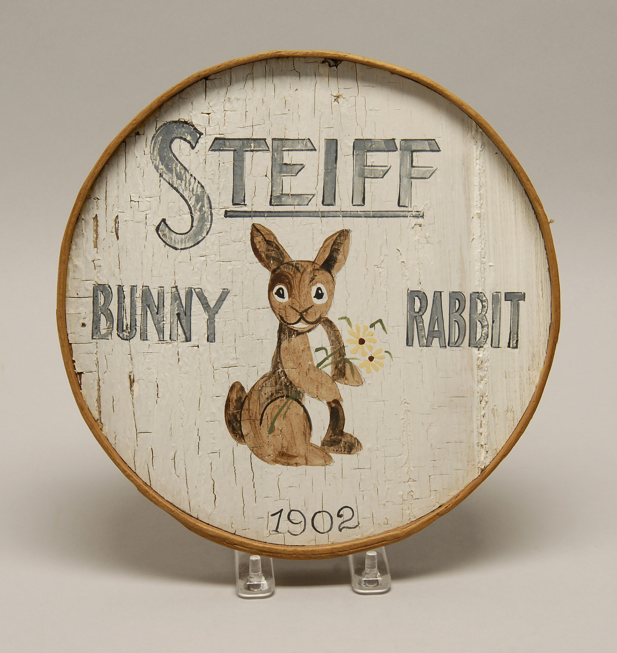 Appraisal: CIRCULAR WOODEN STEIFF SIGN th CenturySteiff Bunny Rabbit in blue