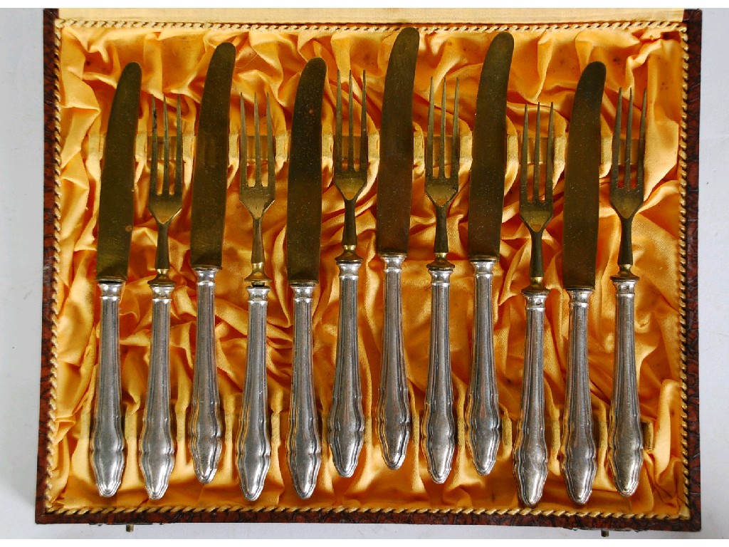 Appraisal: SIX PAIRS OF GERMAN DESSERT KNIVES AND FORKS with silver