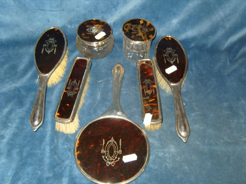 Appraisal: A collection of silver and tortoiseshell backed dressing table ware