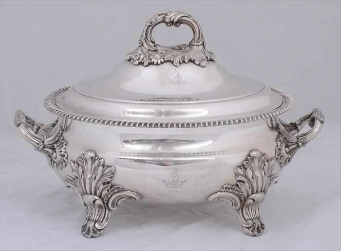 Appraisal: ENGLISH ARMORIAL SILVER-PLATED TWO-HANDLED OVAL TUREEN AND COVER With everted