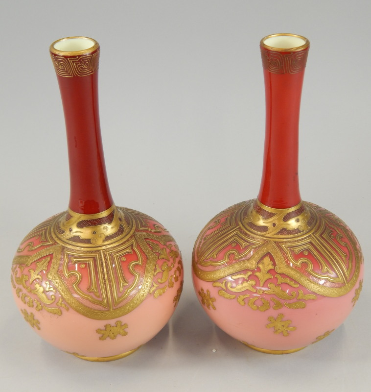 Appraisal: A pair of Victorian pink and red tinted opaque bottle