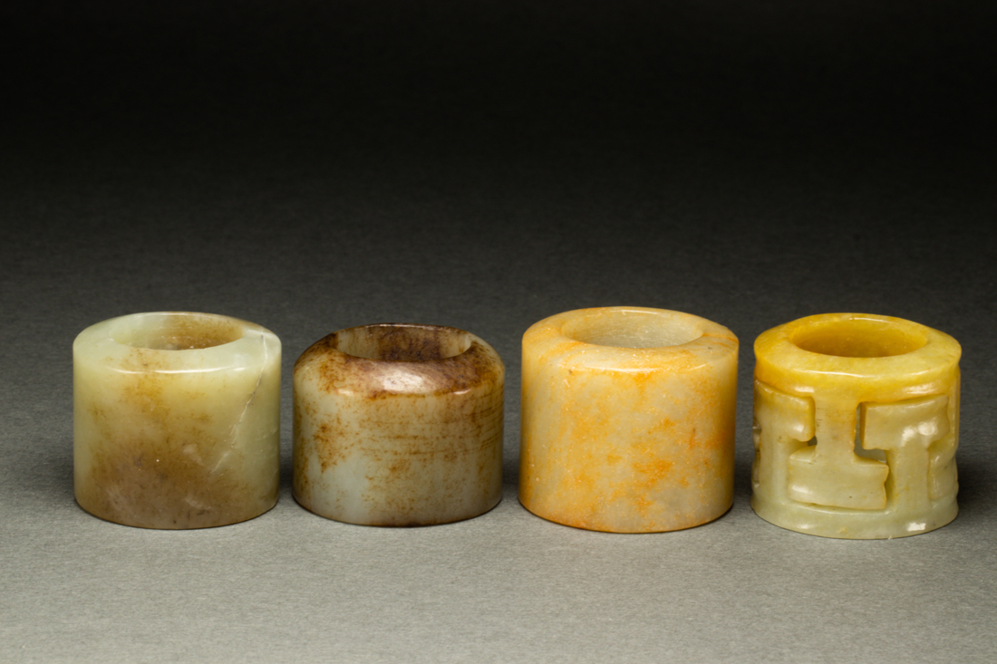 Appraisal: lot of Chinese jade and hardstone archer's rings comprising pale