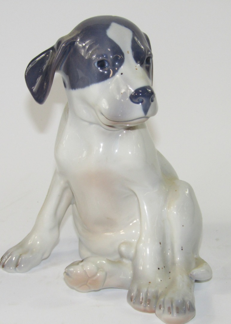 Appraisal: A Royal Copenhagen model of a seated puppy No cm