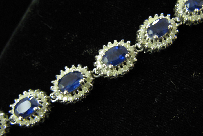 Appraisal: BLUE SAPPHIRE DIAMOND AND FOURTEEN KARAT WHITE GOLD BRACELET WITH