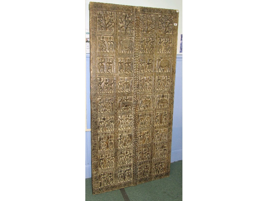 Appraisal: Carved wall panel depicting dancing figures and animals