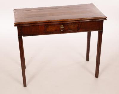 Appraisal: A George III mahogany card table fitted a drawer on