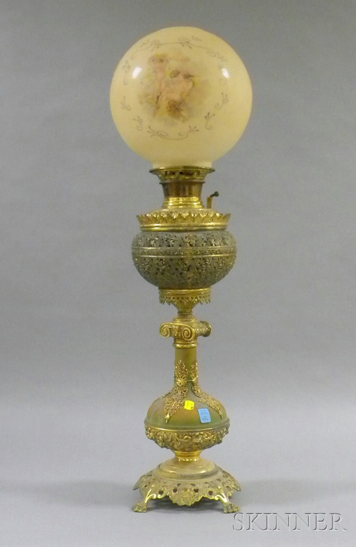 Appraisal: Victorian Table Lamp gone-with-the-wind globular shade with putti decoration over