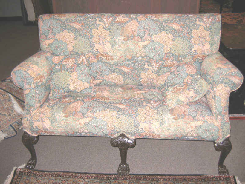 Appraisal: AMERICAN CHIPPENDALE STYLE UPHOLSTERED LOVESEAT Padded allover on six acanthus