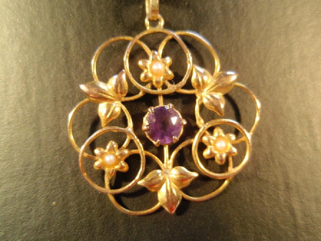 Appraisal: A circular floral Edwardian pendant set with a small central