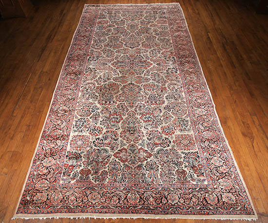 Appraisal: Sarouk Rug Circa Beige ground with flowering urn and floral