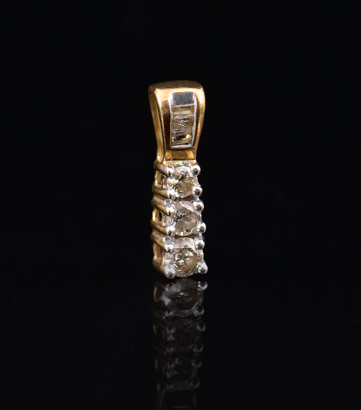 Appraisal: PAST PRESENT AND FUTURE DIAMOND PENDANT K yellow gold pendant