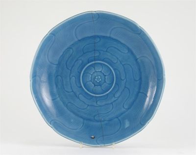 Appraisal: A Chinese blue ground saucer dish moulded and carved as