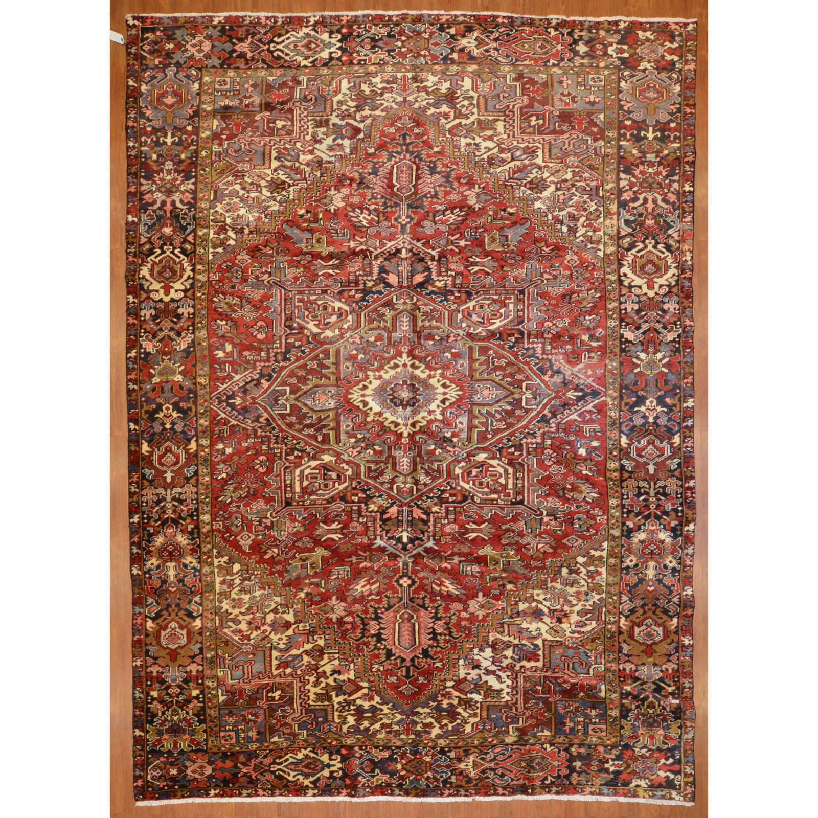 Appraisal: HERIZ RUG PERSIA X Fourth quarter- th century hand-knotted wool