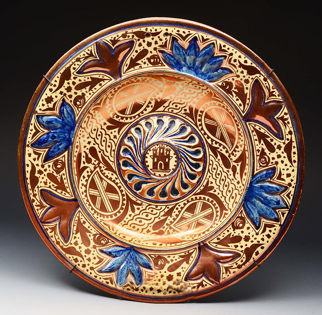 Appraisal: A VALENCIA MANISES COPPER AND BLUE LUSTRE CIRCULAR LOBED DISH