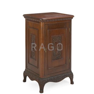 Appraisal: LATE VICTORIAN MUSIC CABINET Mahogany with carved harp design to