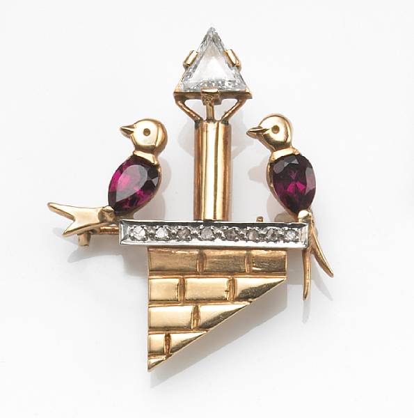 Appraisal: A diamond rhodolite garnet and k gold bird motif brooch