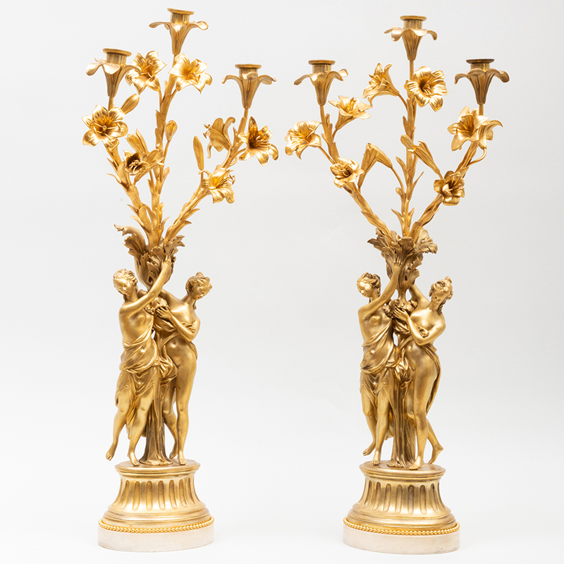 Appraisal: PAIR OF LOUIS XVI STYLE GILT-BRONZE AND MARBLE FIGURAL THREE-LIGHT