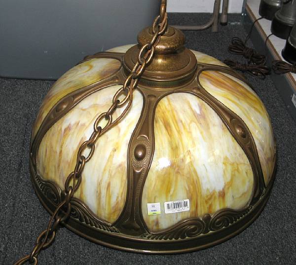 Appraisal: An American burnished gilt metal and yellow slag glass hanging