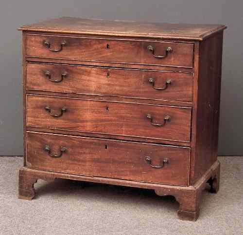 Appraisal: A George III mahogany chest fitted four long graduated drawers