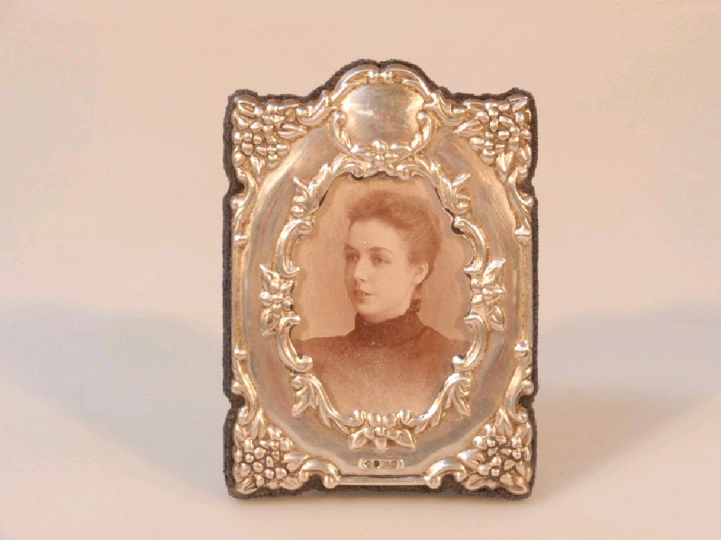 Appraisal: A thC silver faced photograph frame embossed with floral sprays