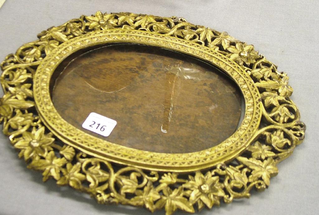 Appraisal: Attractive oval giltwood picture frame carved and pierced with foliate