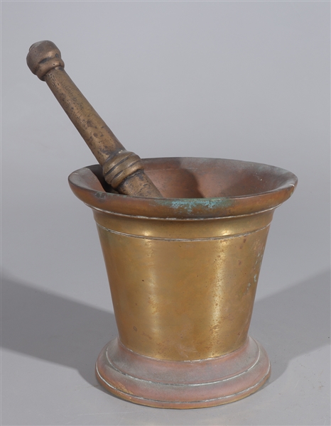 Appraisal: Indian bronze mortar and pestle with incised circles designs around