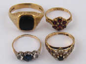 Appraisal: A mixed lot comprising four carat gold rings gross weight