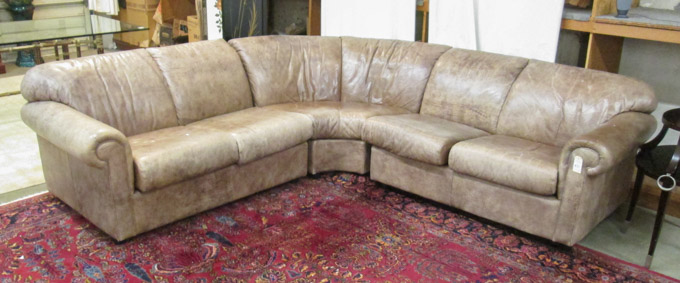 Appraisal: THREE-PIECE LEATHER SECTIONAL SOFA SET Leather Center Furniture Stores modern