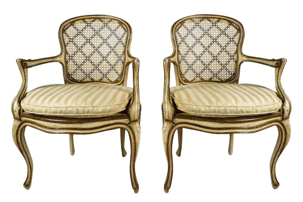 Appraisal: PAIR OF ITALIAN PAINTED GILT FAUTEUILSwith caned seats and backs