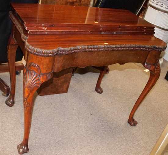 Appraisal: Chippendale style mahogany flip-top table with three extension leaves Estimate