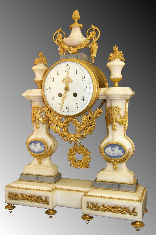 Appraisal: French ormolu and white marble two train mantel clock the