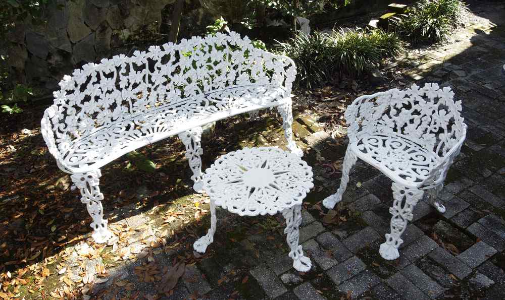 Appraisal: CAST IRON GRAPE DESIGN GARDEN BENCH AND CHAIR Sold with