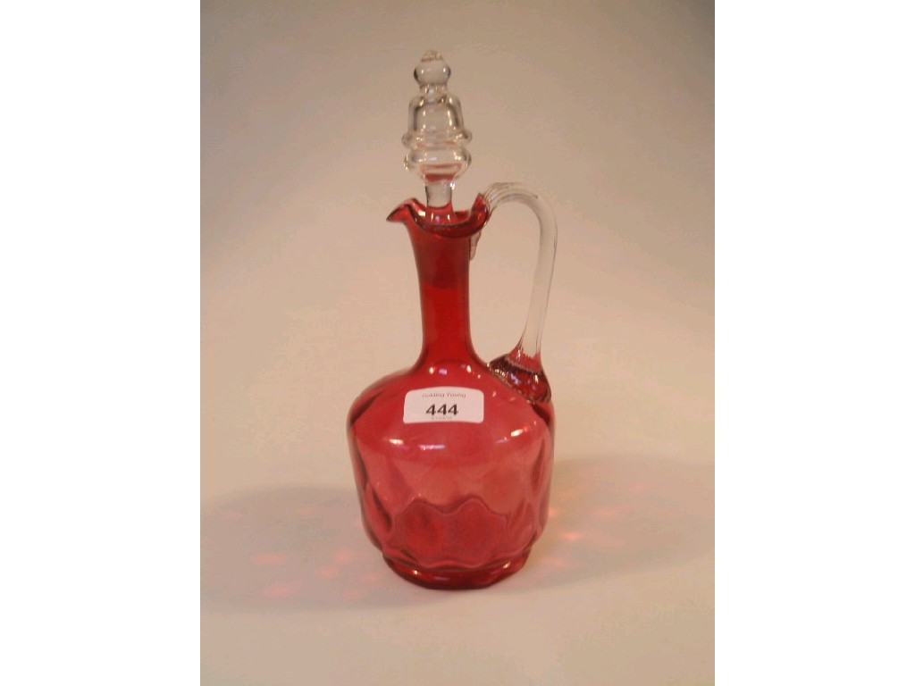 Appraisal: A Victorian cranberry glass ewer with clear glass stopper cm