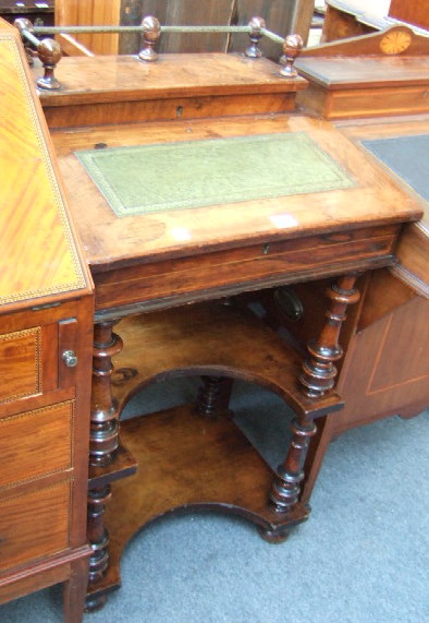 Appraisal: A Victorian walnut Davenport the galleried lift top over gilt