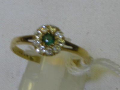 Appraisal: AN EMERALD AND DIAMOND FLOWER RING set in ct yellow