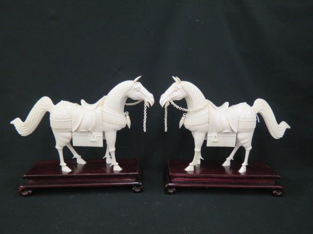 Appraisal: Pair of Chinese Carved Ivory Horse Figurines in fancy parade