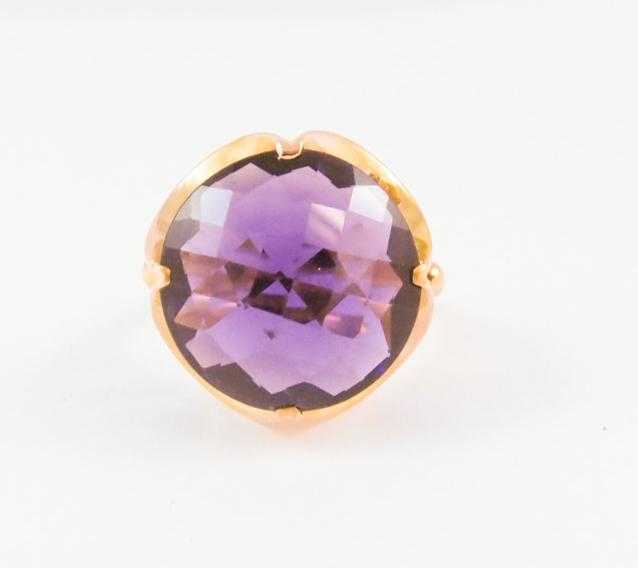 Appraisal: AMETHYST AND FOURTEEN KARAT GOLD SOLITAIRE RING set with a