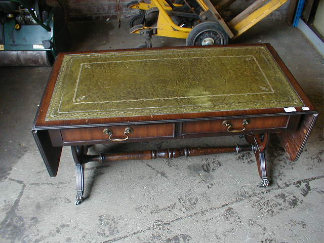 Appraisal: A reproduction mahogany sofa table