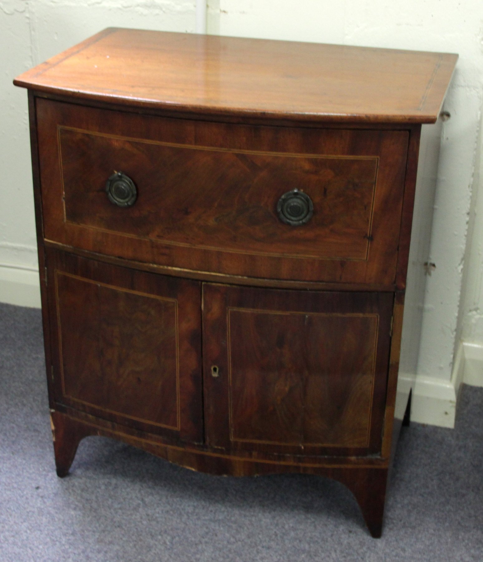 Appraisal: A th Century mahogany bowfronted commode the top with inlaid