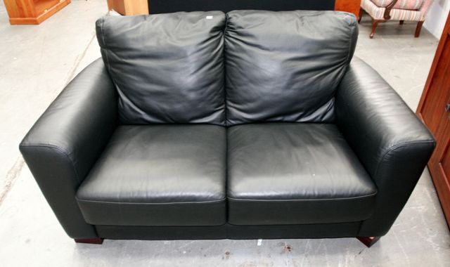 Appraisal: A contemporary black leather two seater sofa