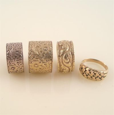 Appraisal: Two wide ct gold rings with foliate scroll decoration the