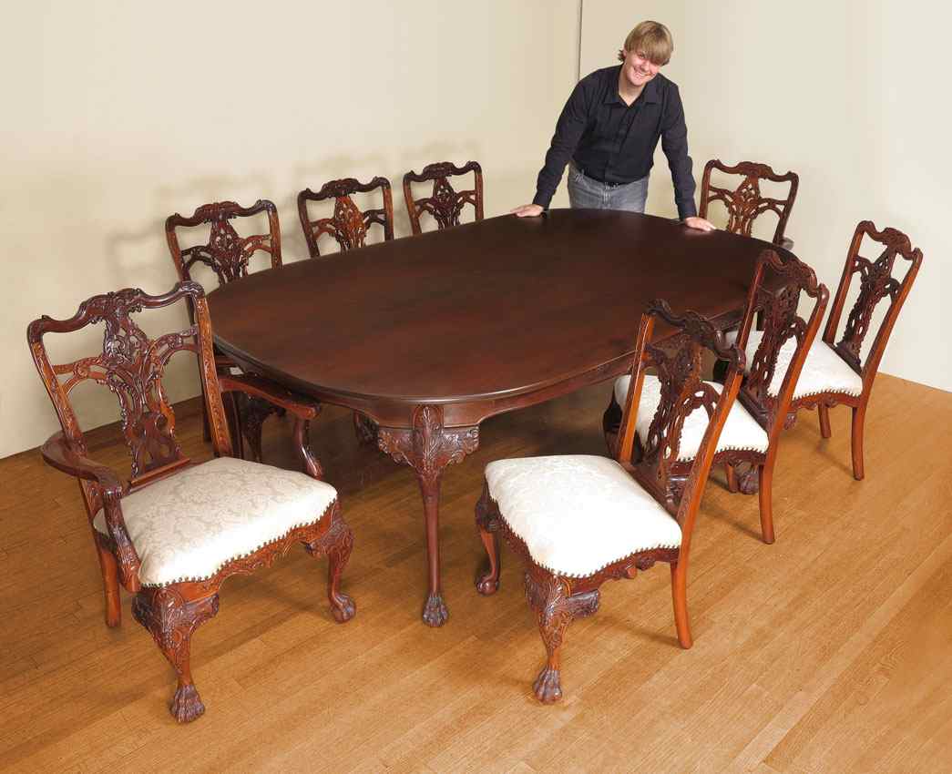 Appraisal: CHIPPENDALE STYLE CARVED HONDURAN MAHOGANY DINING TABLE AND CHAIRS BY