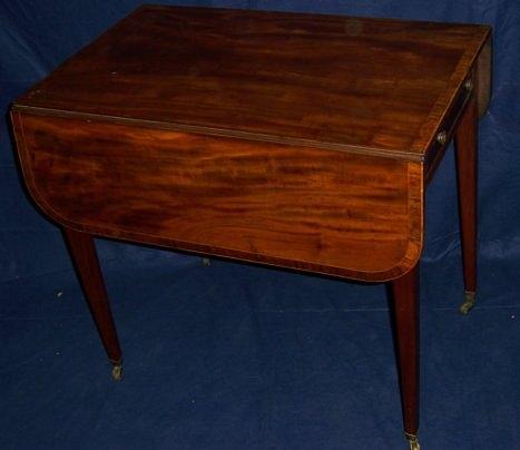 Appraisal: A George III mahogany and rosewood Pembroke table the top