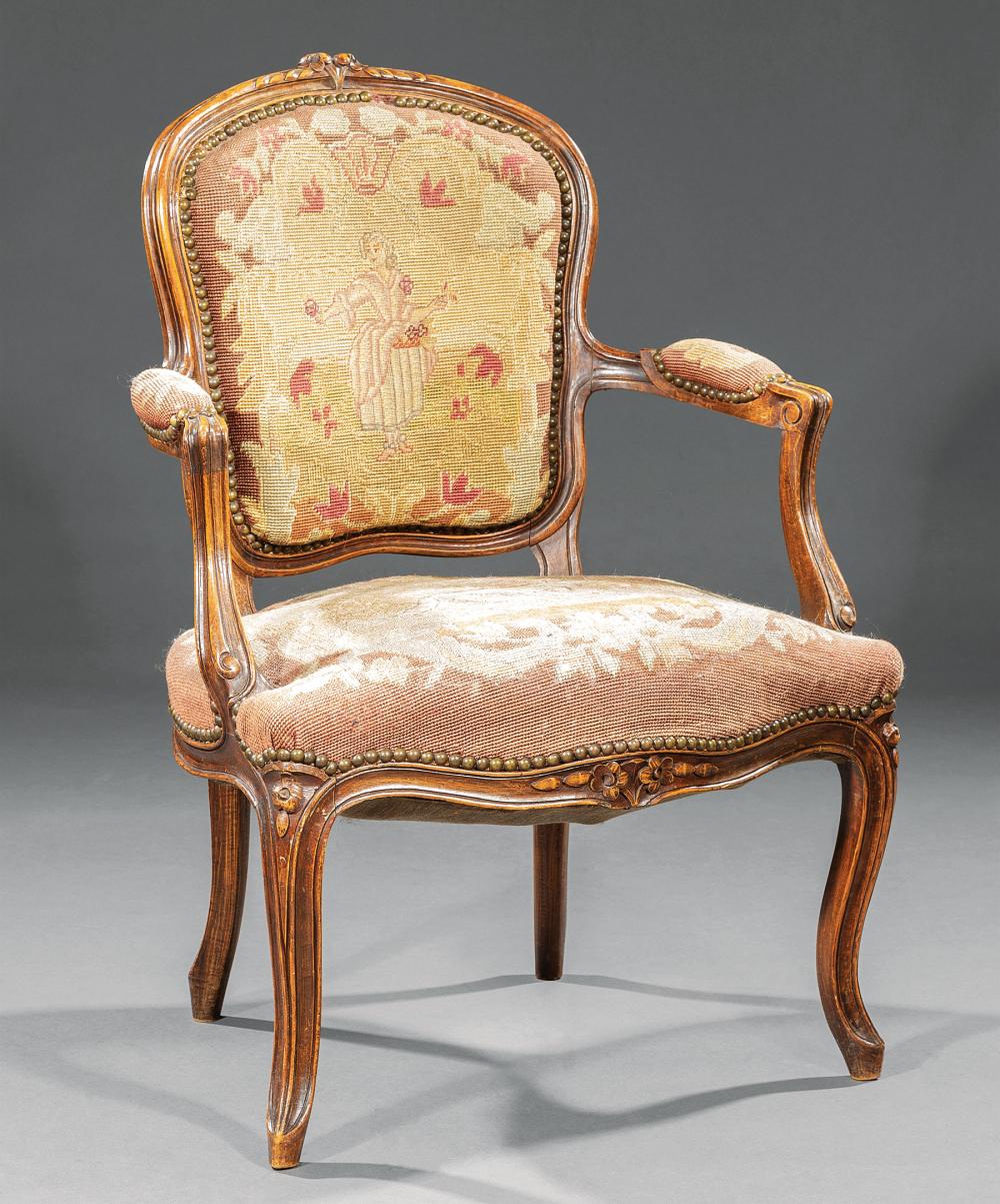 Appraisal: Antique Louis XV-Style Carved Walnut Fauteuil th c foliate crest